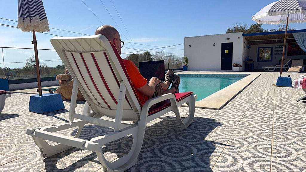 Alex working by the pool