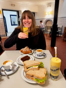 Lisa eating breakfast in Pastéis de Belém