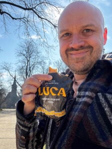 Alex with a pastry from Luca bakery in Bucharest
