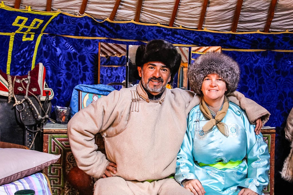 Kristin Smith and Xavier Traditional Clothes Mongolia Kristin Smith and Xavier wearing traditional clothes in Mongolia on a couple travel sabbatical