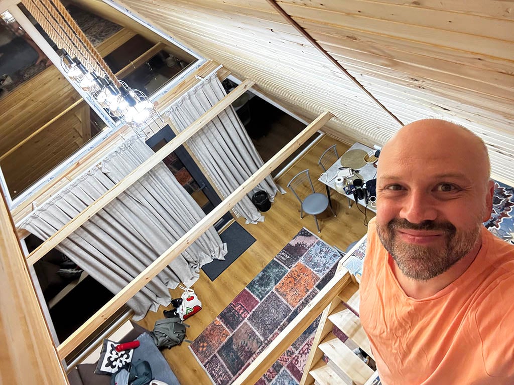 Alex inside our A-frame: view from the top floor