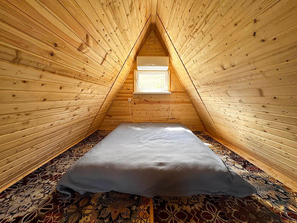 A-frame upper bedroom